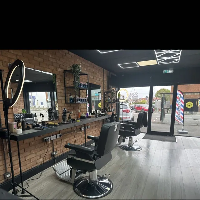 Inside SAM Barbers: the chairs, sofa and brick wall
